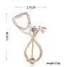 BrochesStethoscope shaped brooch with crystal