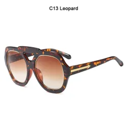 Gafas de solGafas de sol modernas - montura oversize - flecha metálica decorativa - unisex