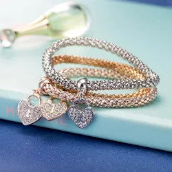 PulseraElegante pulsera de tres piezas - con corazones de cristal - plata - oro - oro rosa
