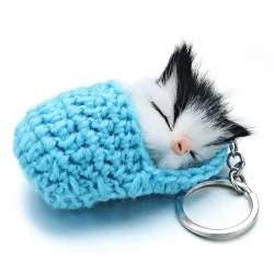 llaveroGato durmiendo en un catre tejido a mano - llavero