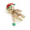 BrochesBroche osito de cristal - gorro navideño rojo -