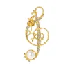 BrochesNota musical de cristal dorado con perla - broche