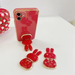 TitularesSoporte para teléfono plegable - soporte - conejito chino rojo