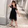 RopaElegante vestido negro de gasa con lunares