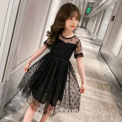 RopaElegante vestido negro de gasa con lunares