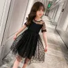 RopaElegante vestido negro de gasa con lunares