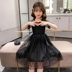 RopaElegante vestido negro de gasa con lunares