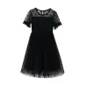 RopaElegante vestido negro de gasa con lunares