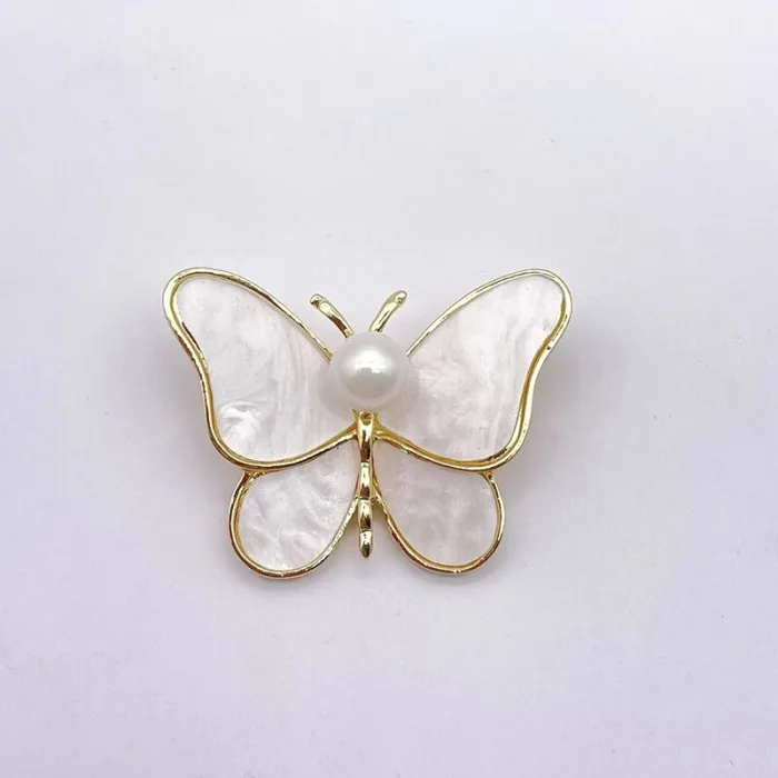 BrochesBroche mariposa concha blanca - con perla -